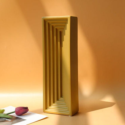 Modern gold tabletop vase with architectural rectangular silhouette