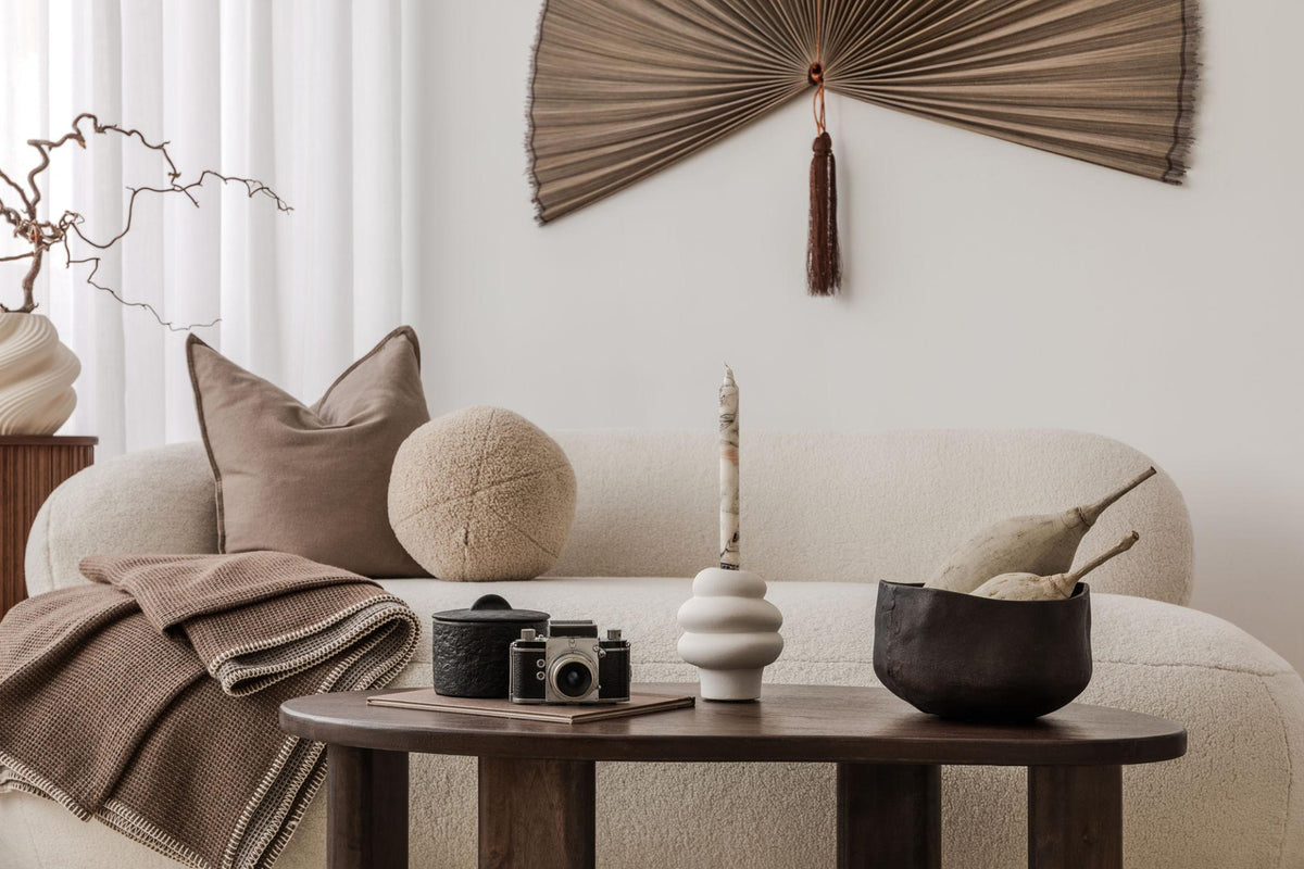 Luxury contemporary interior styled with sculptural decor and warm editorial lighting