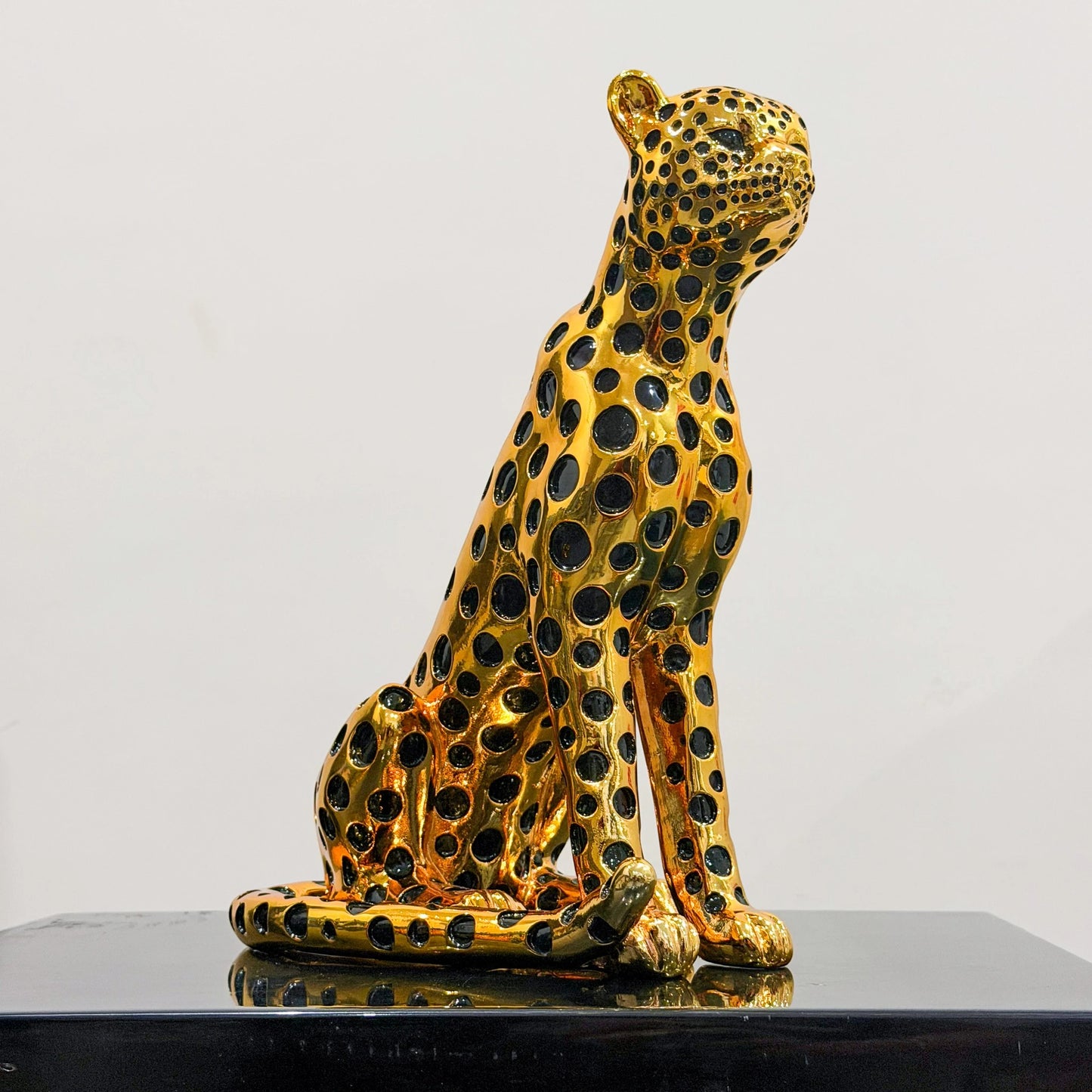 luxury leopard figurine in gold with black detailing modern decor