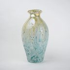 Rounded decorative vase with a narrow neck and marbled finish.