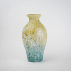 Rounded decorative vase with a narrow neck and marbled finish.