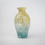 Rounded decorative vase with a narrow neck and marbled finish.
