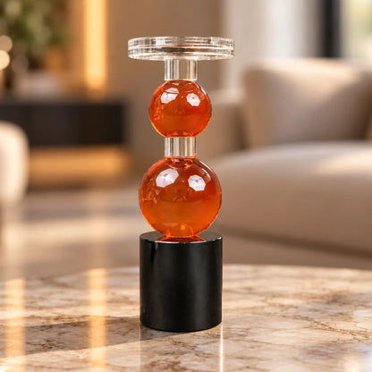 amber glass orb candle holder with black base modern decor