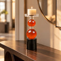 amber glass orb candle holder with black base modern decor