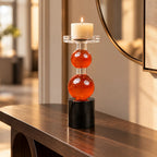 amber glass orb candle holder with black base modern decor