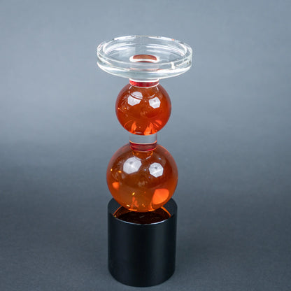 amber glass orb candle holder with black base modern decor