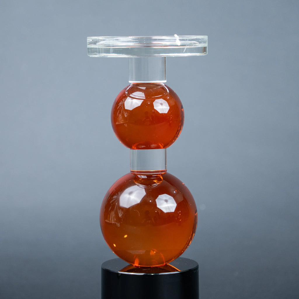 amber glass orb candle holder with black base modern decor