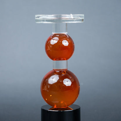 amber glass orb candle holder with black base modern decor