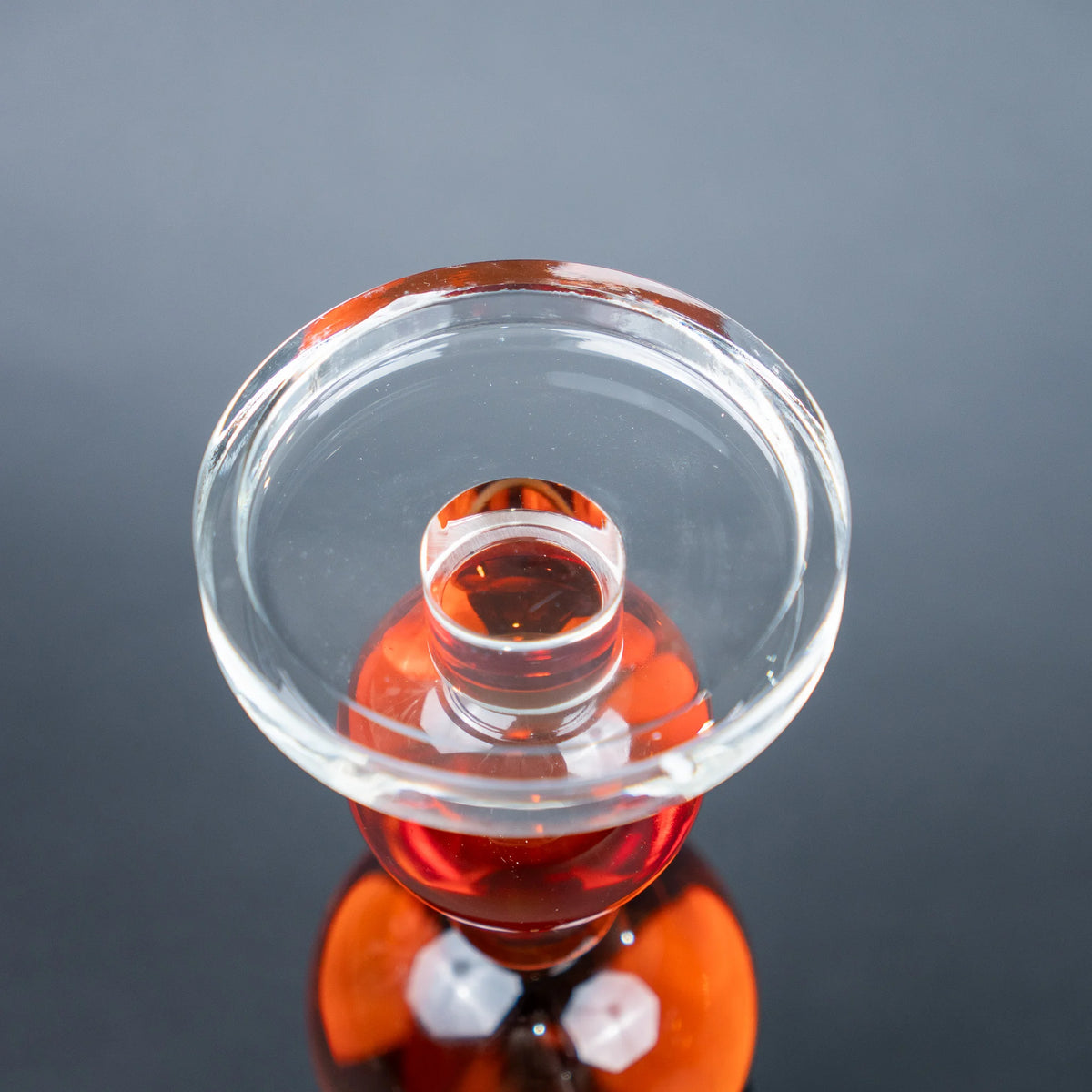 amber glass orb candle holder with black base modern decor