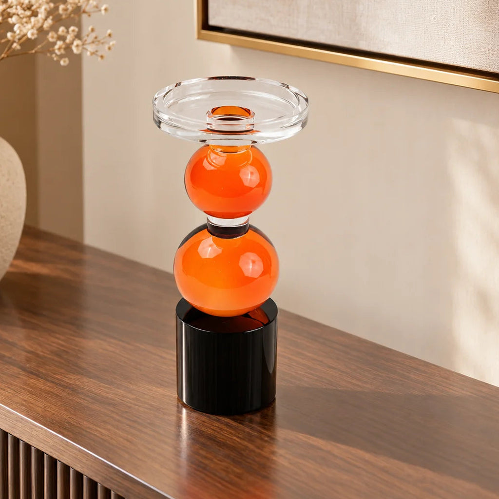 amber glass orb candle holder with black base modern decor
