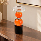 amber glass orb candle holder with black base modern decor
