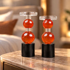 amber glass orb candle holder with black base modern decor