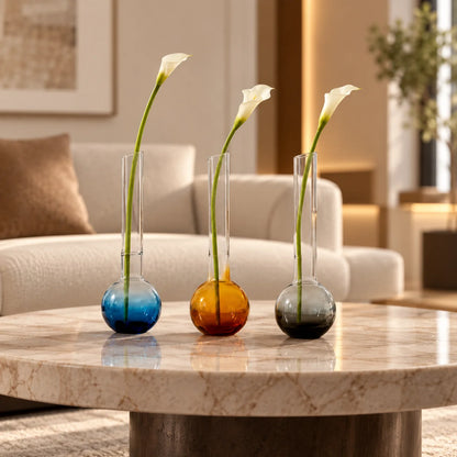 Glass vase with spherical base and elongated cylindrical neck designed for single stem floral arrangements