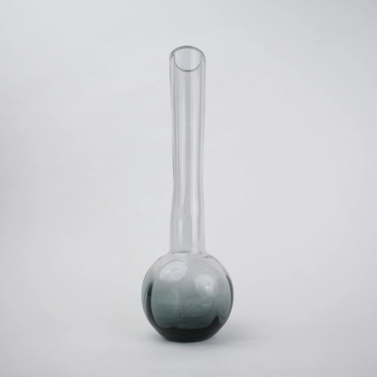 Glass vase with spherical base and elongated cylindrical neck designed for single stem floral arrangements