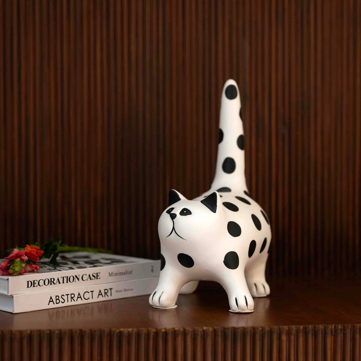 Decorative cat accent with bold monochrome polka dot design