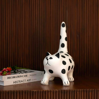 Decorative cat accent with bold monochrome polka dot design