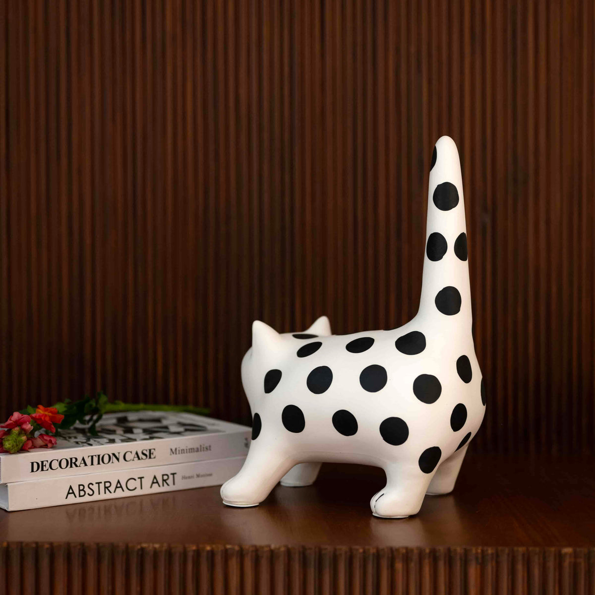 Decorative cat accent with bold monochrome polka dot design