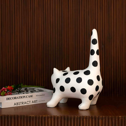 Decorative cat accent with bold monochrome polka dot design