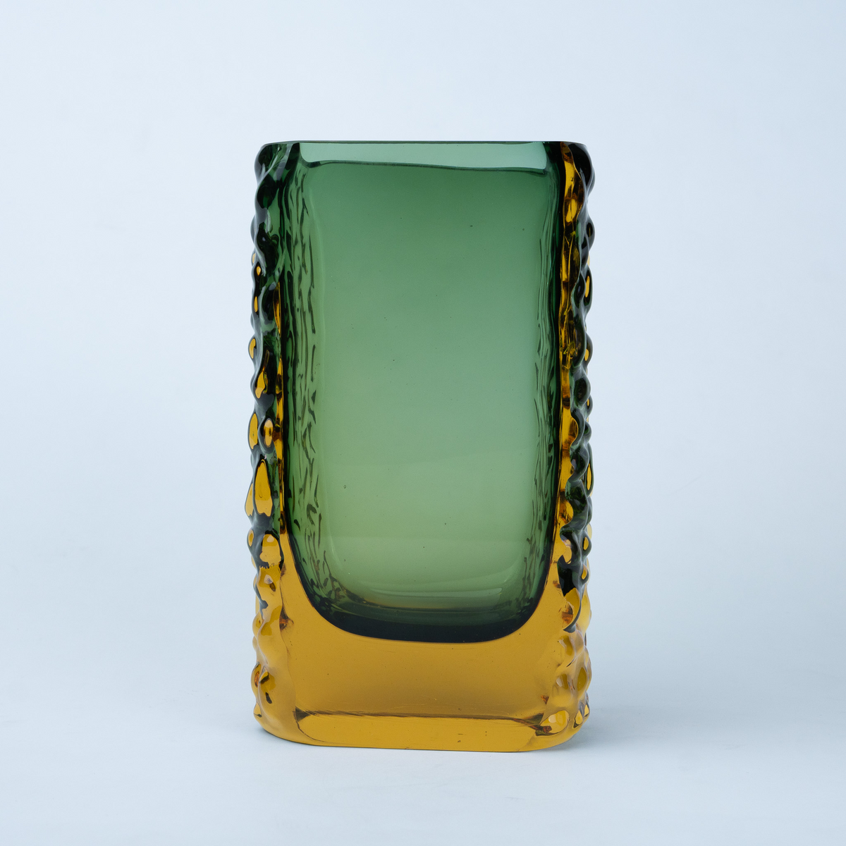 Olive green glass vase with a textured exterior and golden-toned base