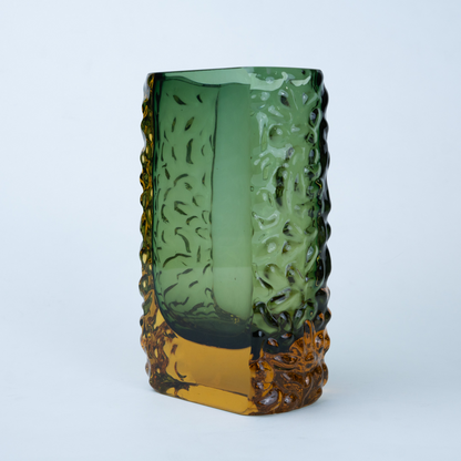 Olive green glass vase with a textured exterior and golden-toned base