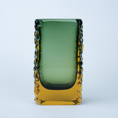 Olive green glass vase with a textured exterior and golden-toned base