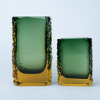 Olive green glass vase with a textured exterior and golden-toned base