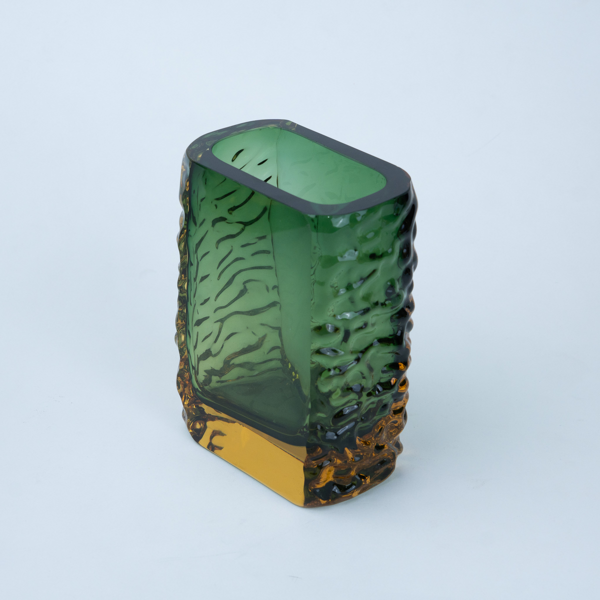Olive green glass vase with a textured exterior and golden-toned base