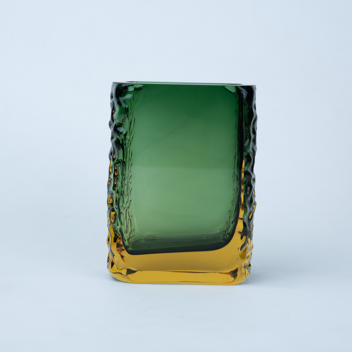 Olive green glass vase with a textured exterior and golden-toned base