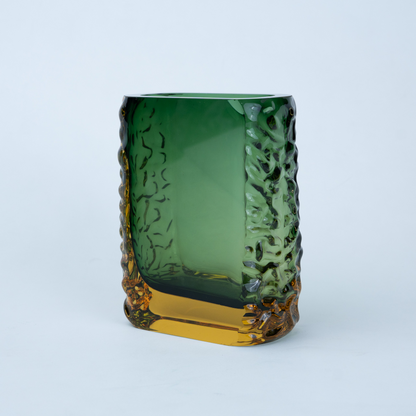Olive green glass vase with a textured exterior and golden-toned base