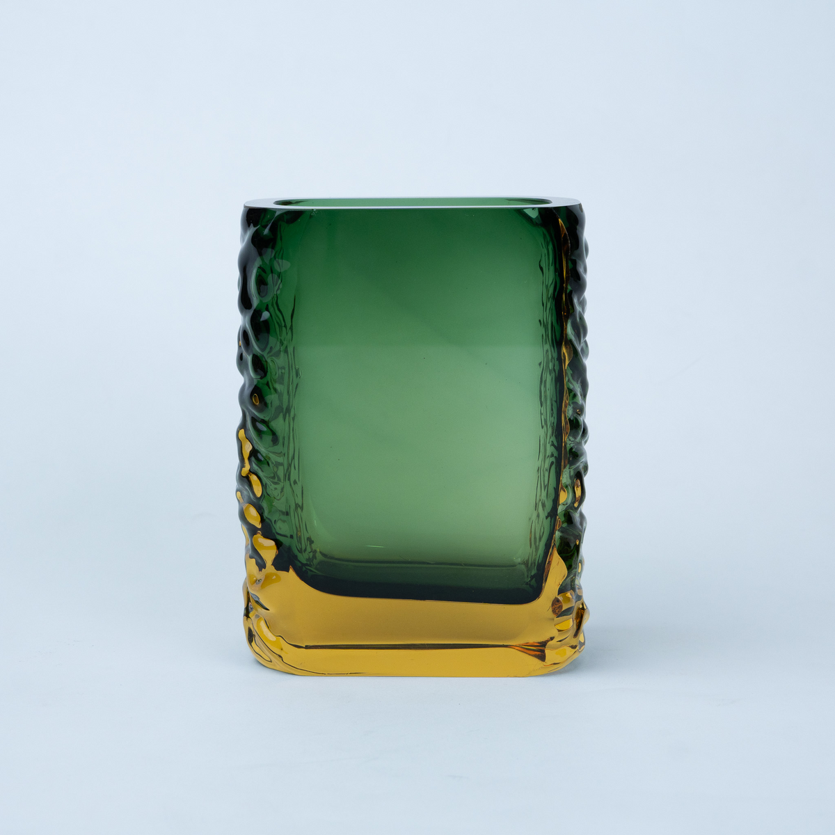 Olive green glass vase with a textured exterior and golden-toned base