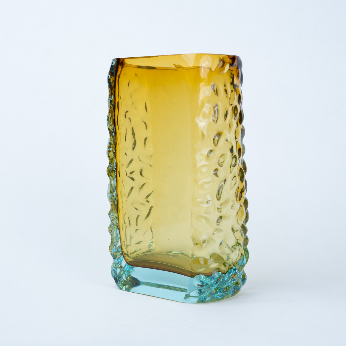 Sunset Gold textured glass vase with a translucent golden body and blue-tinted base