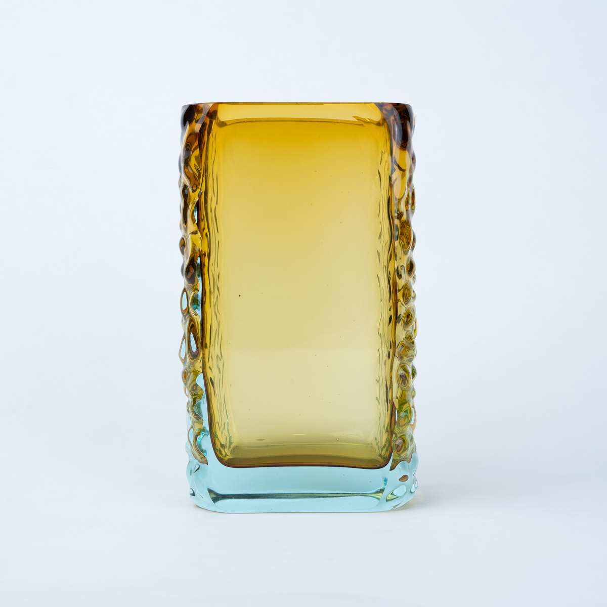 Sunset Gold textured glass vase with a translucent golden body and blue-tinted base