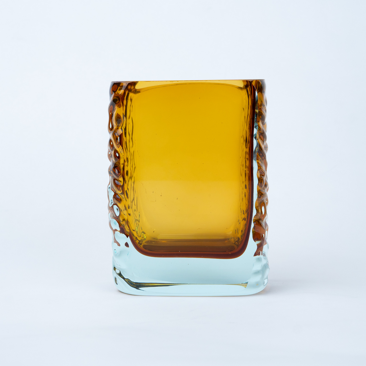 Sunset Gold textured glass vase with a translucent golden body and blue-tinted base