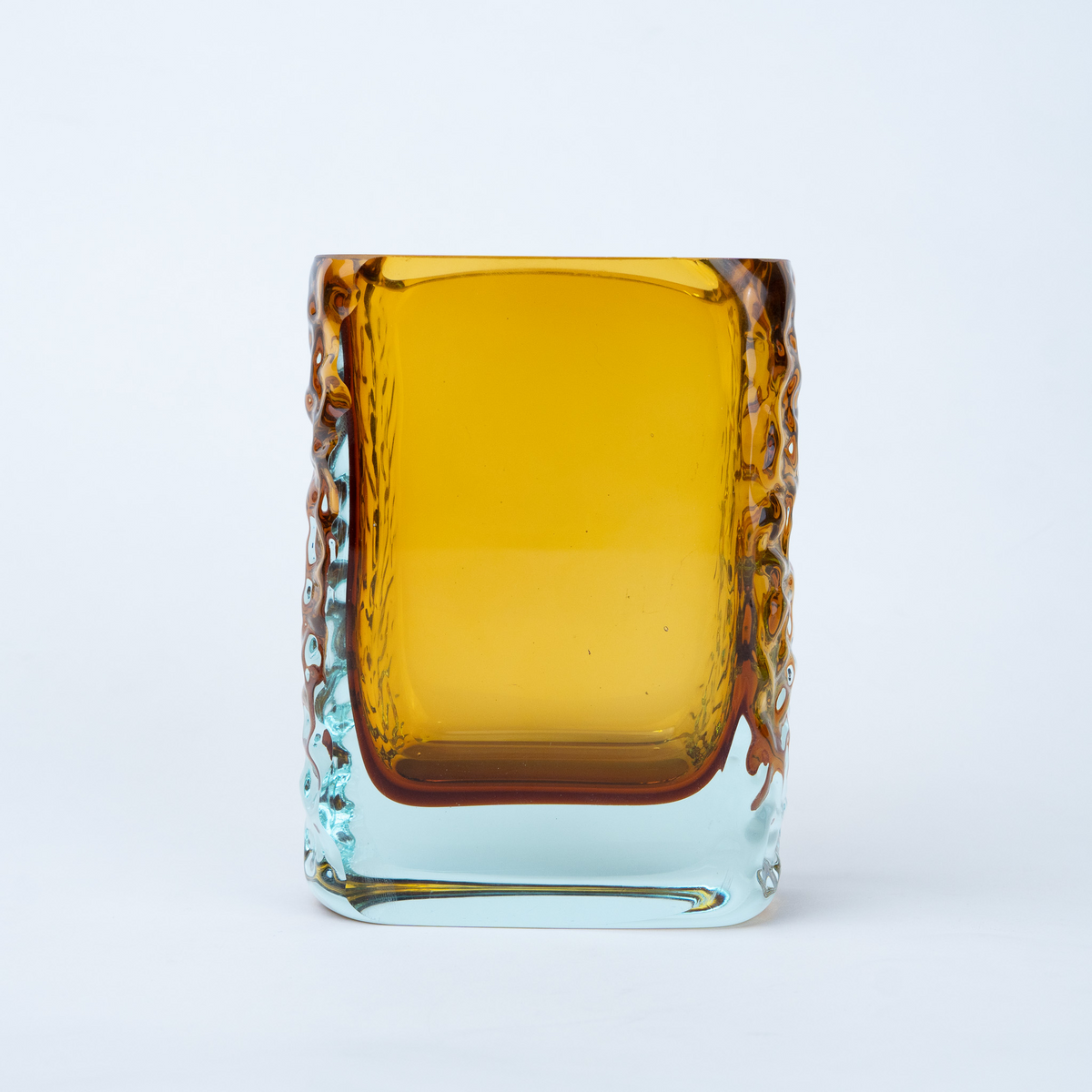Sunset Gold textured glass vase with a translucent golden body and blue-tinted base