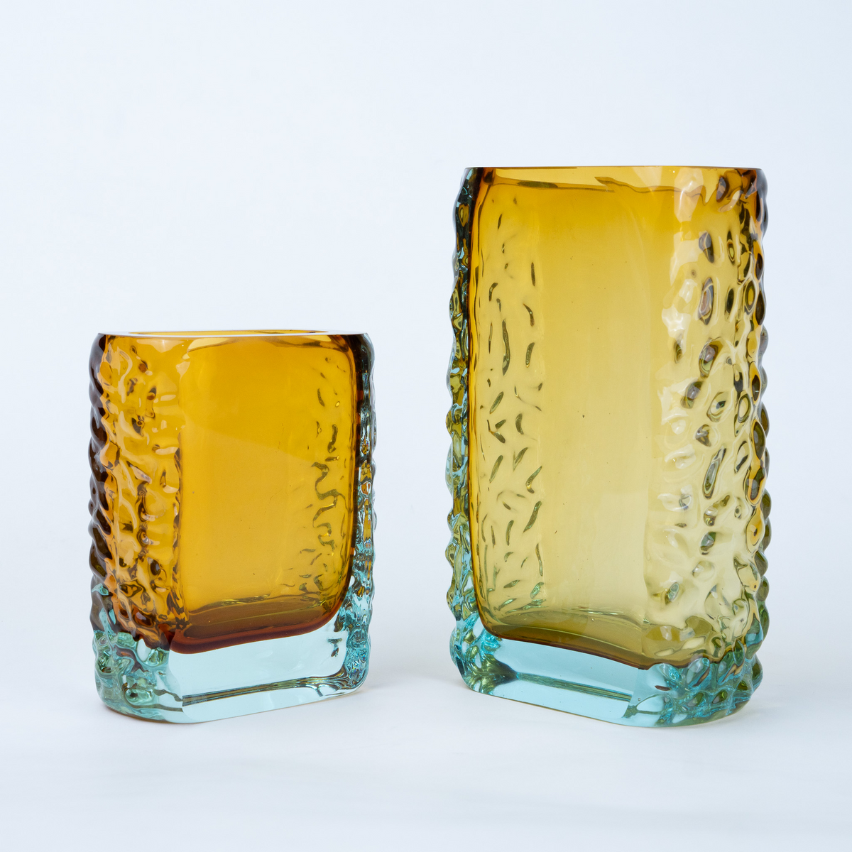 Sunset Gold textured glass vase with a translucent golden body and blue-tinted base