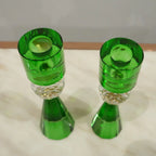 Decorative crystal candle holders with faceted base and elegant silhouette