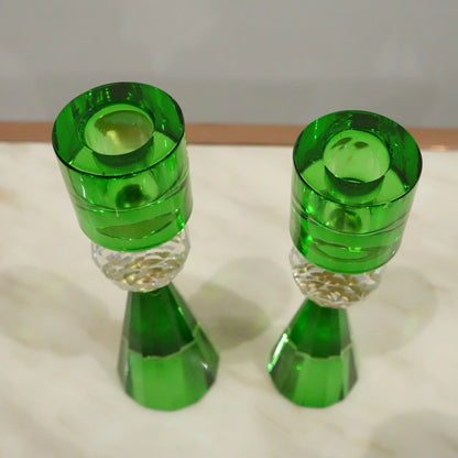 Decorative crystal candle holders with faceted base and elegant silhouette