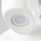 Glossy white reading sculpture lamp with abstract seated figure holding a book and built-in LED light.