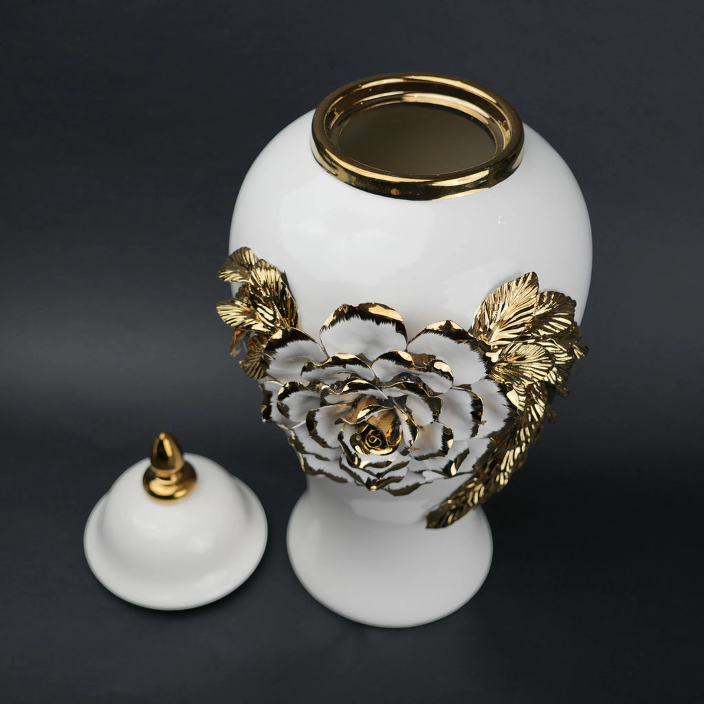 White ceramic jar with gold leaf design and lid