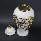 White ceramic jar with gold leaf design and lid