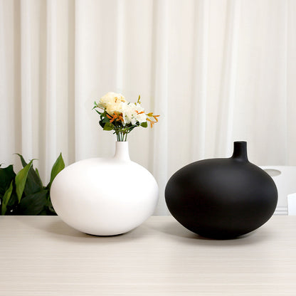 Modern organic shape resin vase with minimalist matte finish for contemporary home decor