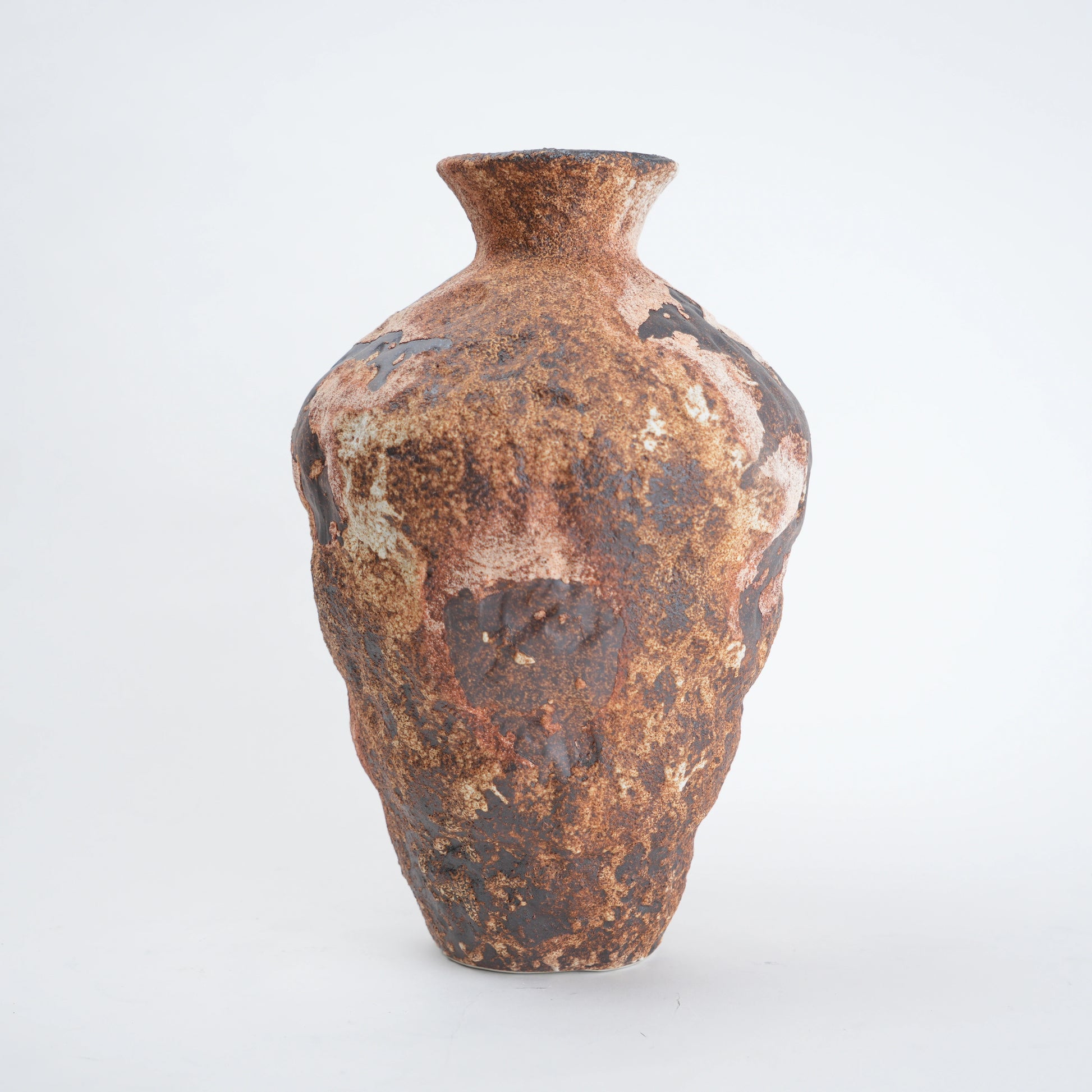 Rust-colored ceramic vase on a white background