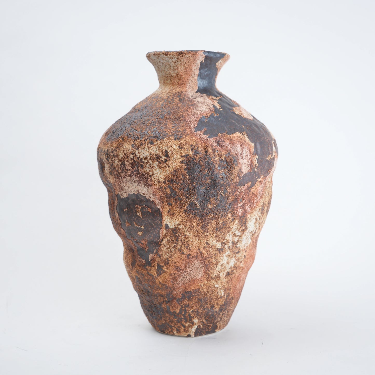 Rustic brown ceramic vase on a white background