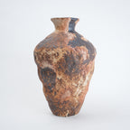 Rustic brown ceramic vase on a white background