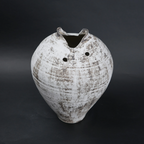Vintage ceramic vase with a textured surface