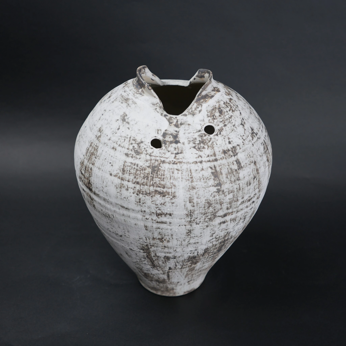 Vintage ceramic vase with a textured surface