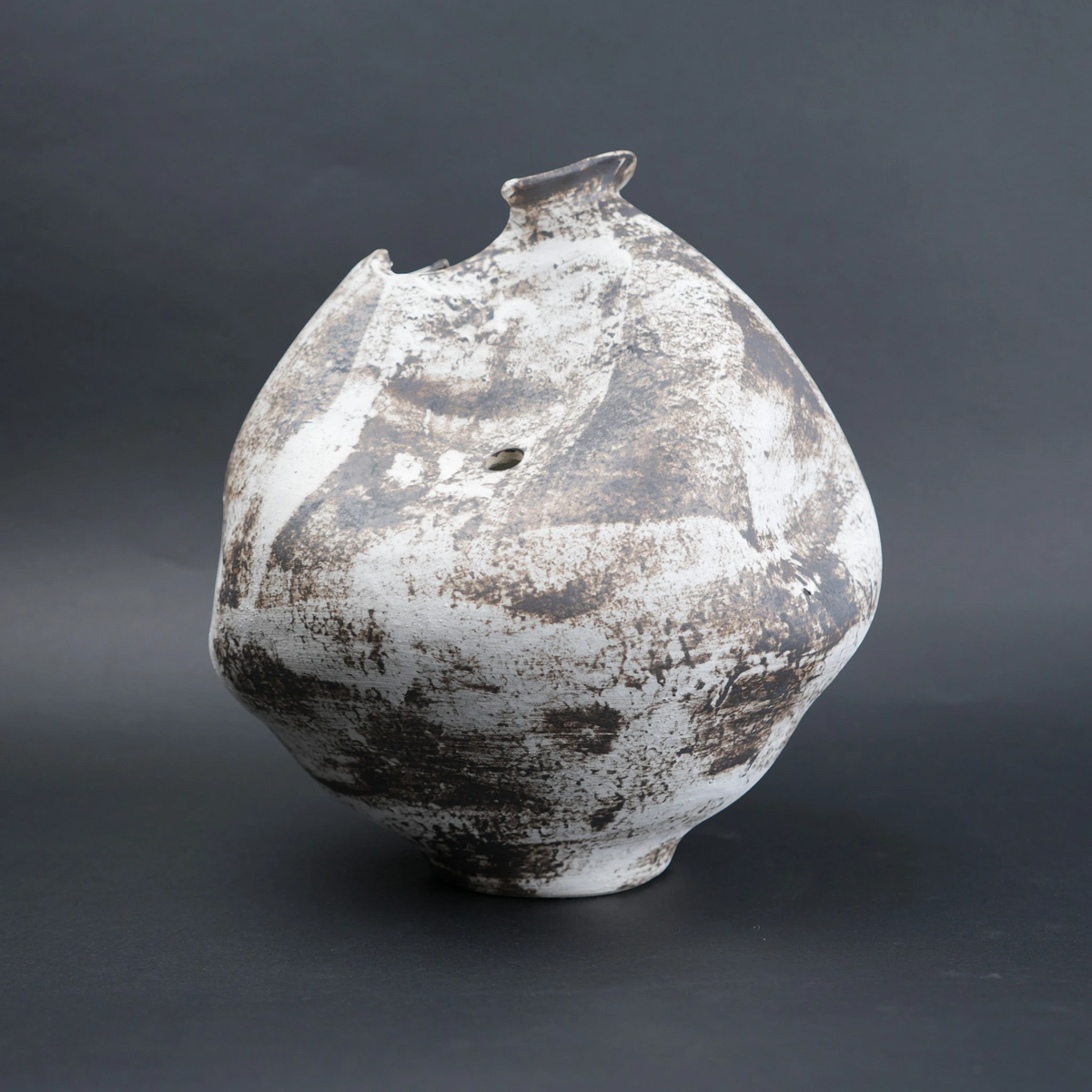Vintage ceramic vase with a textured surface