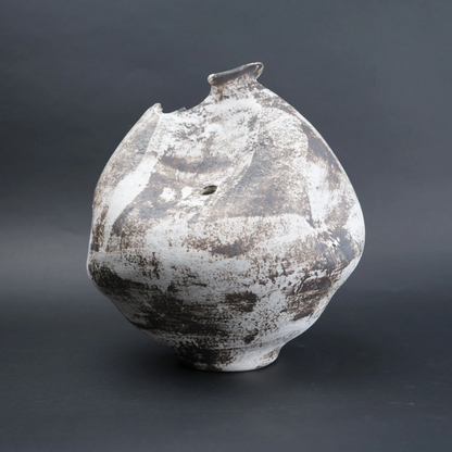 Vintage ceramic vase with a textured surface