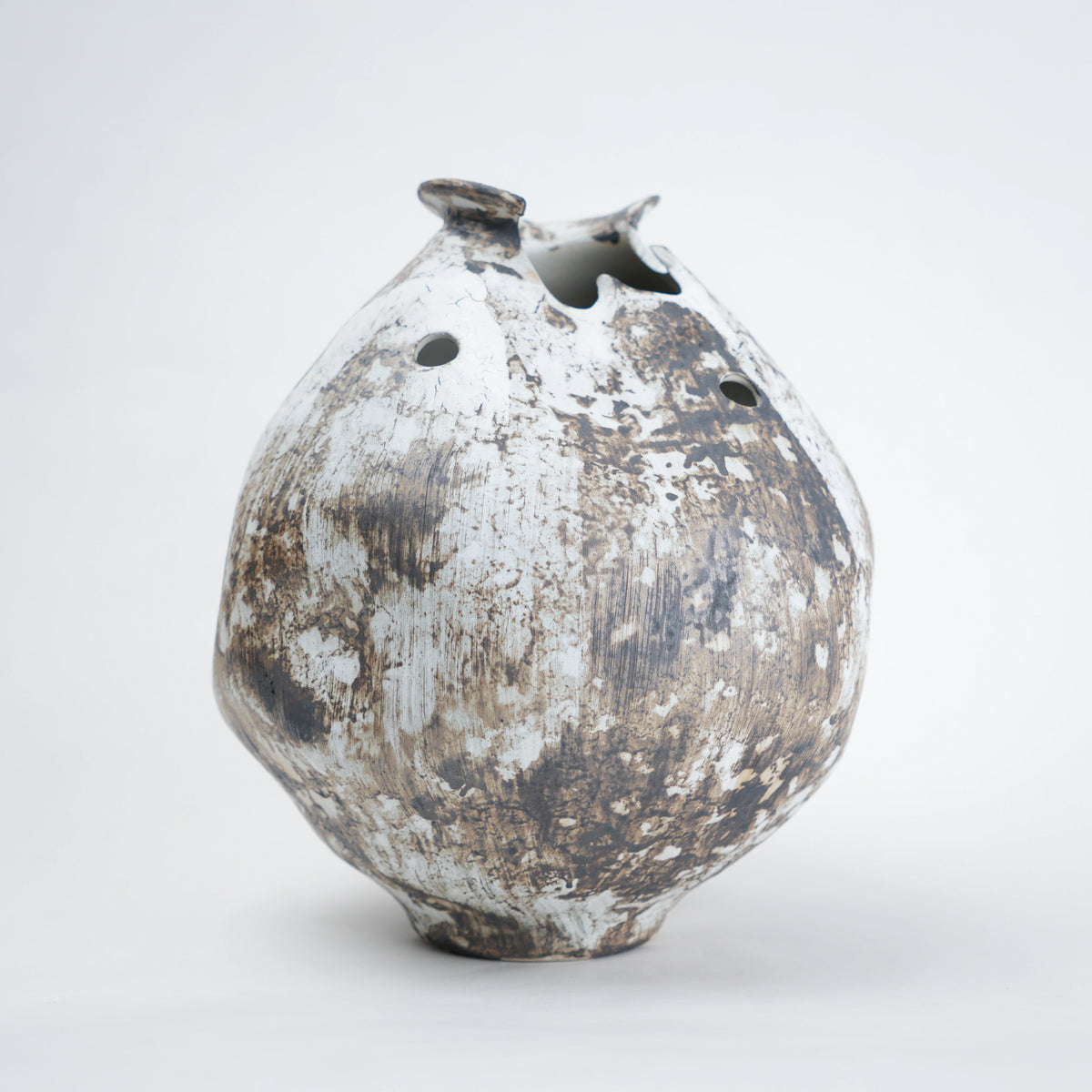 Distressed ceramic vase on a white background