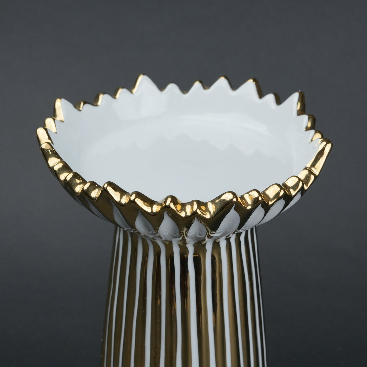 White ceramic candle holder with gold scalloped rim and fluted base for modern home decor styling